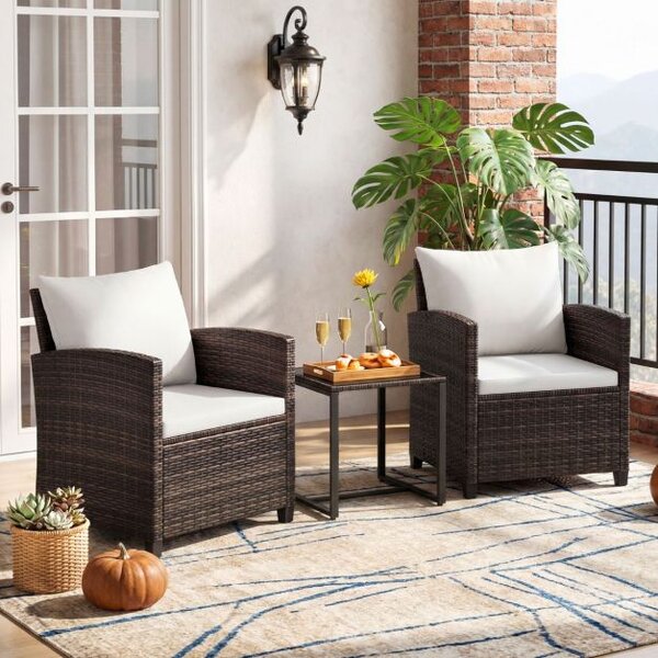 Balkonski komplet iz ratana, vključno z 2 stoloma z blazinami in stekleno mizo