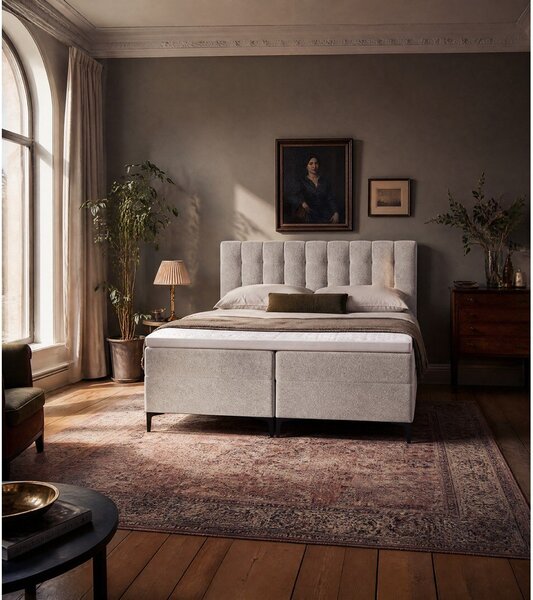 Sivorjava boxspring postelja s prostorom za shranjevanje 180x200 cm Puhala – Makamii