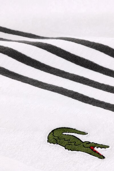 Lacoste Srednje velika bombažna brisača Lacoste LCOURTLI Bitume 90 x 150 cm
