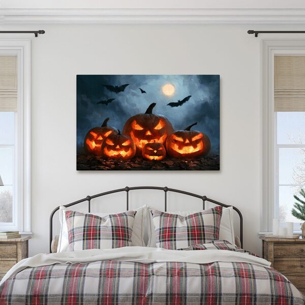 Slika halloweenske buče pod netopirji