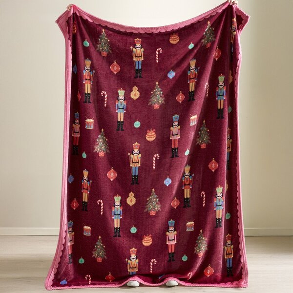 Bordo rdeča/rožnata odeja z božičnim motivom 170x130 cm Christmas Nutcracker – Catherine Lansfield