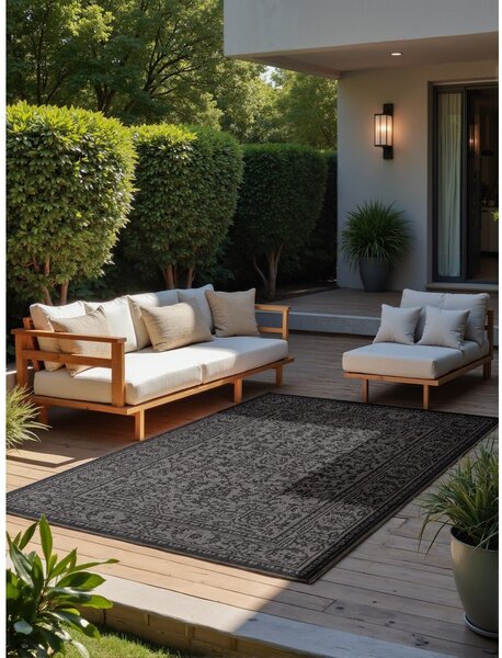 Črno-bela notranja in zunanja preproga 120x170 cm Duet Kona – NORTHRUGS