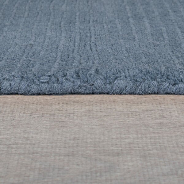 Temno modra ročno tkana volnena preproga 120x170 cm Textured Wool Border – Flair Rugs
