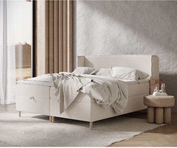 Kremno bela boxspring postelja s prostorom za shranjevanje 160x200 cm Monpelli – Maison de Rêve