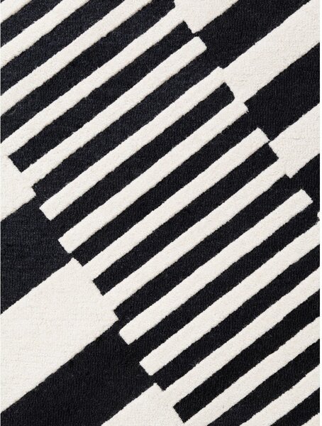 Črno-bela ročno tkana volnena preproga 120x180 cm Stryve Flux – Elle Decoration