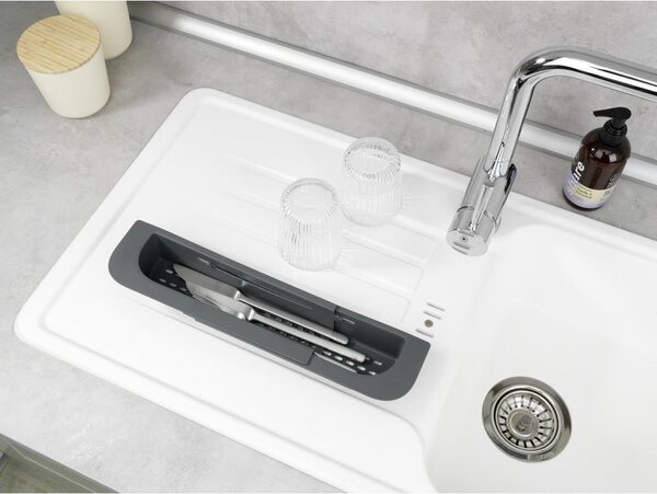 Siv plastičen teleskopski odcejalnik za pomivalno korito 49,5x8,5 cm Fino – Wenko